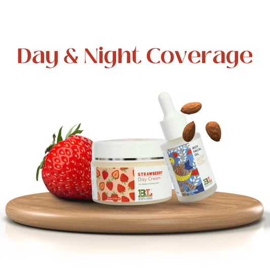 Botanical Luxuriate Day & Night Coverage combo with strawberry day cream and rich facial oil on a wooden tray, featuring strawberries and almonds.