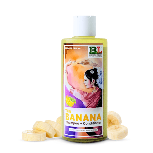 Botanical Luxuriate Banana Shampoo & Conditioner bottle with sliced bananas, enriched with silk protein for glossy hair shine.